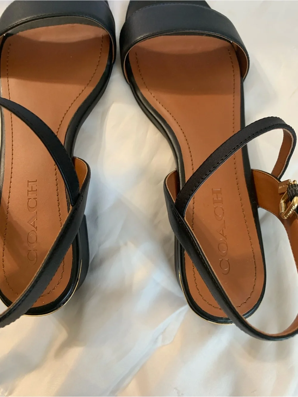 NWOT. Coach smooth leather, black sandals. Gold hardware.